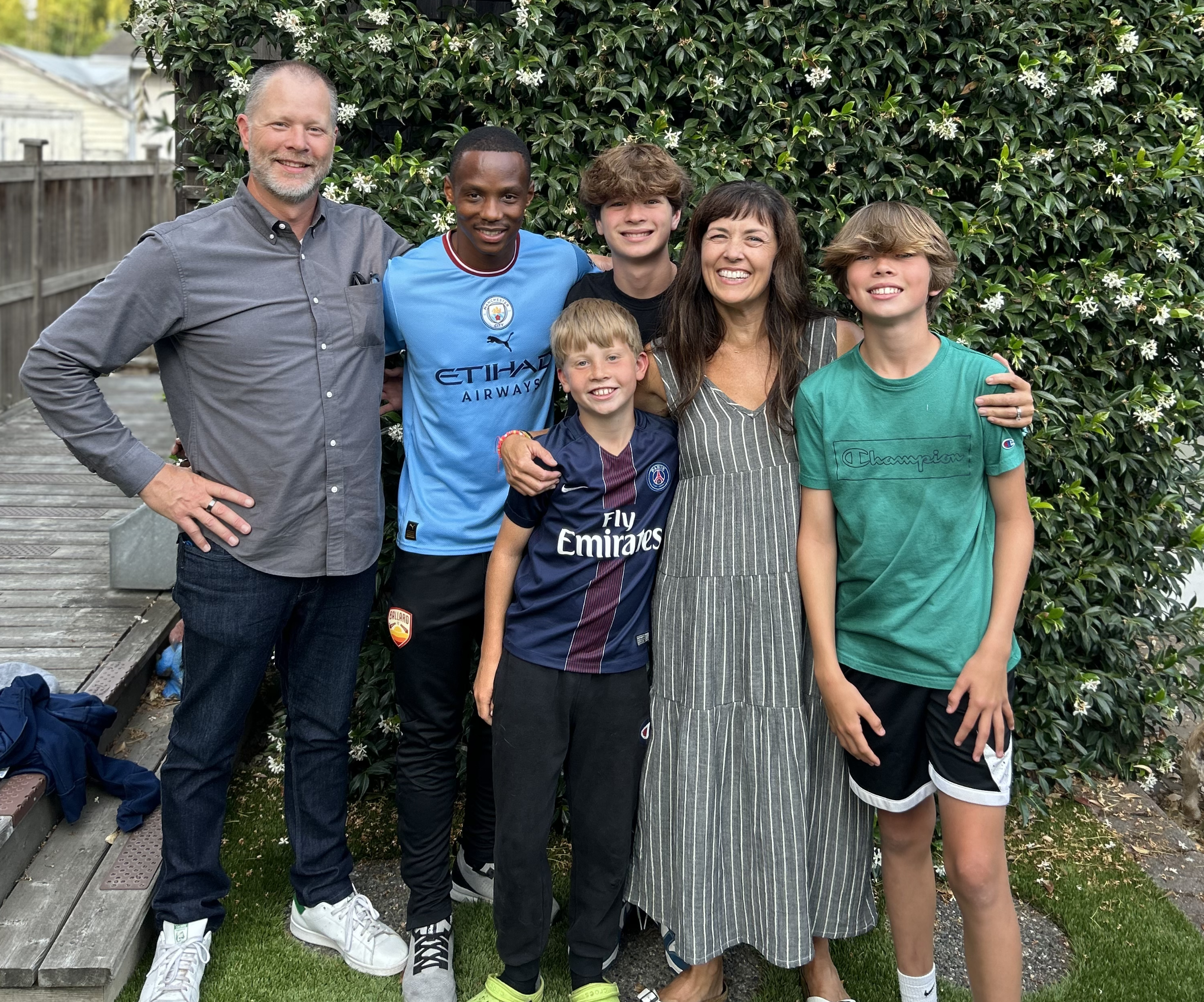 A soccer player with his host family